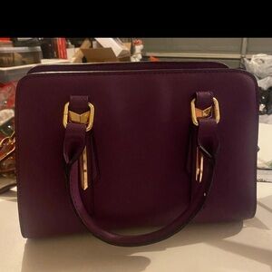 Luxurious Purple Satchel with Gold Accents